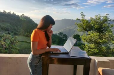 Girl with laptop on terrace
