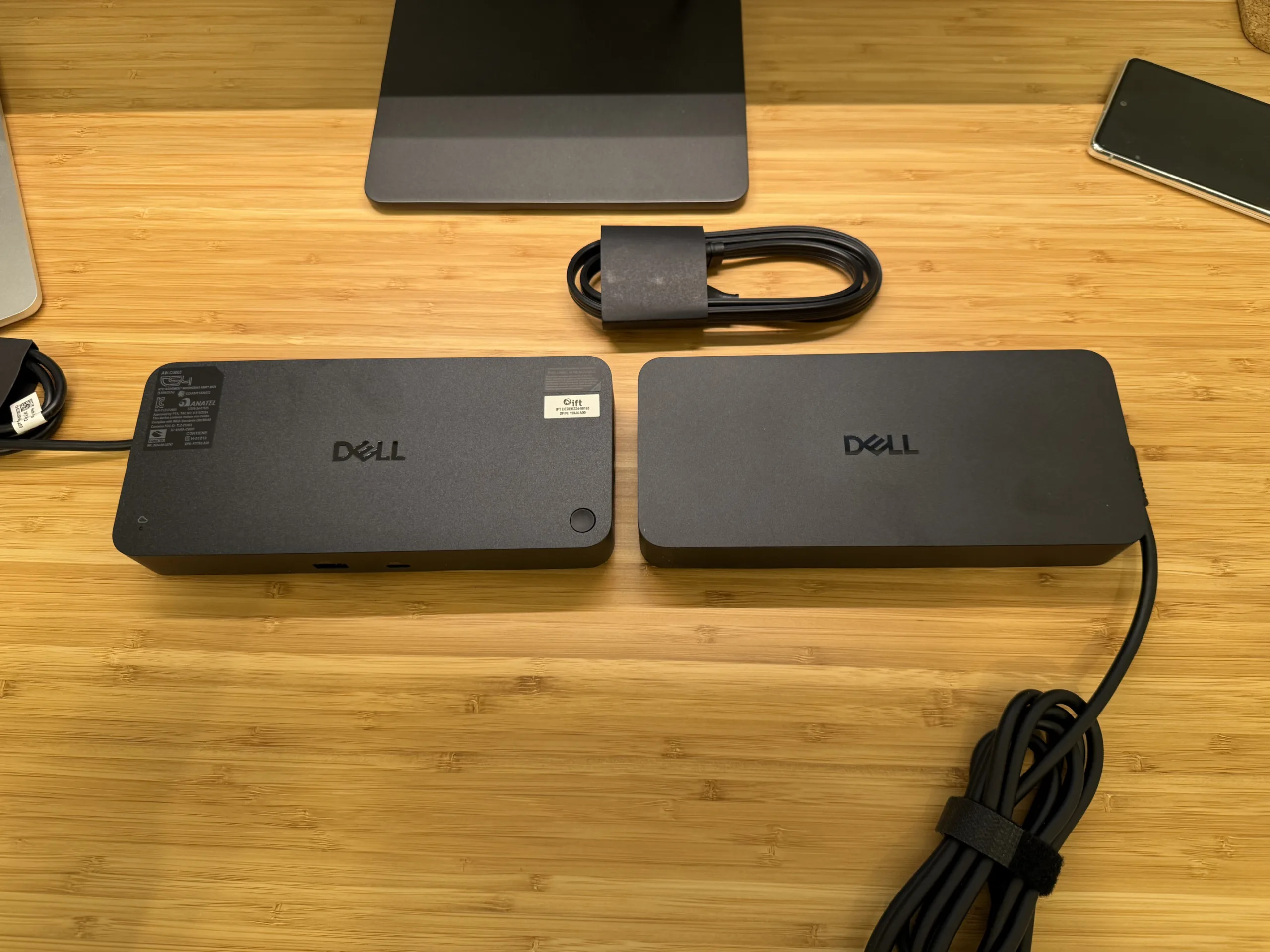 SD25TB5 Dock and Power Brick side by side on a desk