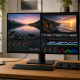 Color-managed photo and video editing workstation with a large monitor and connected laptop.