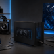Thunderbolt 5 eGPU enclosure and open-frame dock connected to a Windows laptop