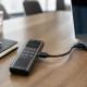 USB-C digital voice recorder connected to a laptop on a work desk